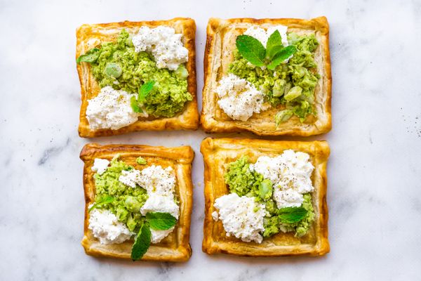 savory puff pastry tarts with ricotta, broad beans and mint