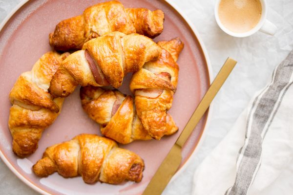 Croissants with bacon and syrup