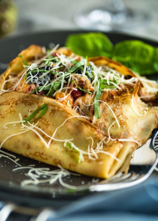Square crepes with savory chicken and mushroom filling with parmesan