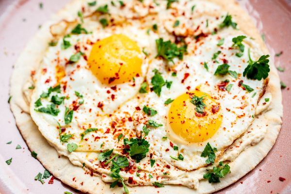 Lebanese bread with fried egg and hummus