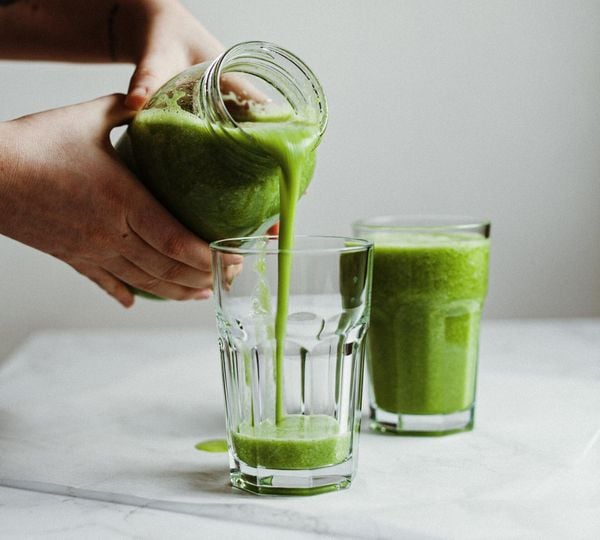 Green smoothie of ripe fruit and mushy vegetables