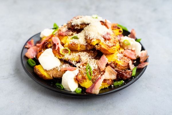 loaded crushed potatoes with bacon, parmesan and spring onion
