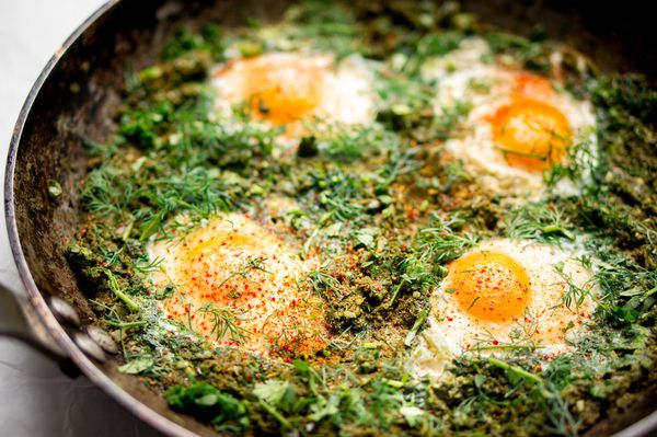 Green shakshuka: poached eggs with spinach