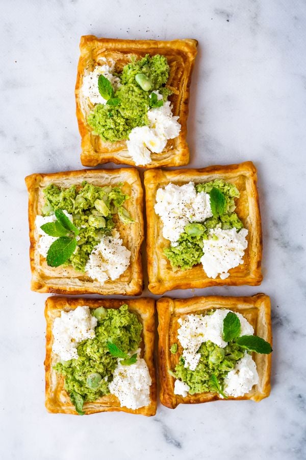 savory puff pastry tarts with ricotta, broad beans and mint