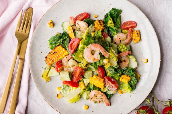 Meal salad with grilled lettuce and shrimp