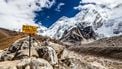 Footpath to Mount Everest Base Camp signpost in Himalayas, Nepal. Khumbu glacier and valley snow on mountain peaks, beautiful view landscape