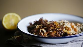 Pulled beef meat with wild rice and chickpeas, cuban cuisine